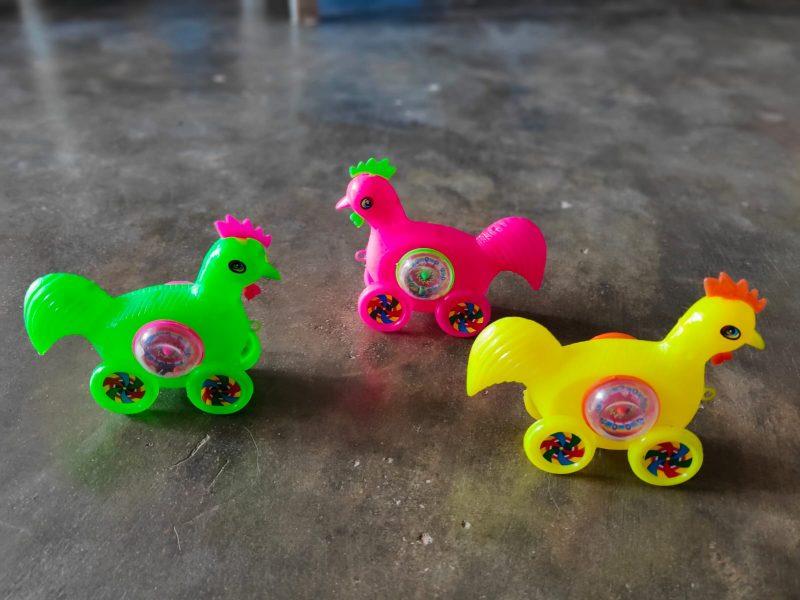 cock moving colorful toys